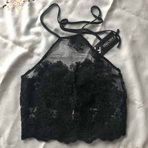 Lace and sheer halter top with back zip